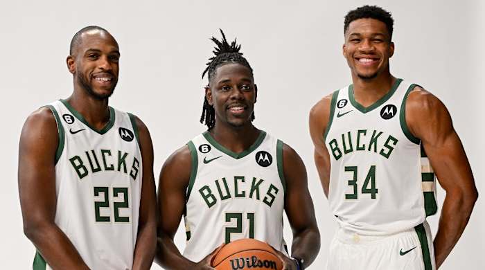 Sep 25, 2022; Milwaukee, WI, USA; Milwaukee Bucks forward Khris Middleton (22), guard Jrue Holiday (21) and forward Giannis Antetokounmpo (34) pose for a picture during media day at the Fiserv Forum.